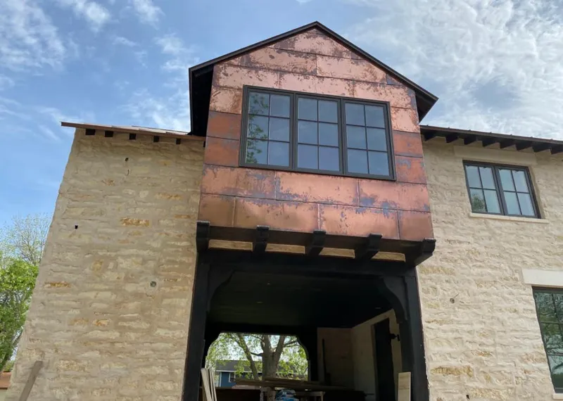 Copper metal panel facade on a stone building for Skylight Installation in Middleburg Heights