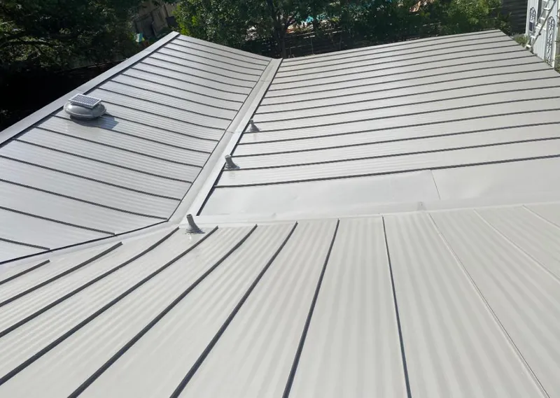 Solar attic fan installed on a metal roof for Roof Ventilation in Middleburg Heights